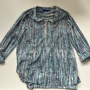 Women’s 1/4” zip, polyester blouse. Dotted print